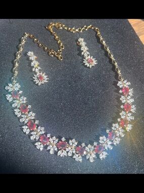 Ruby  necklace with antique gold plated finish with clear swarovski elements